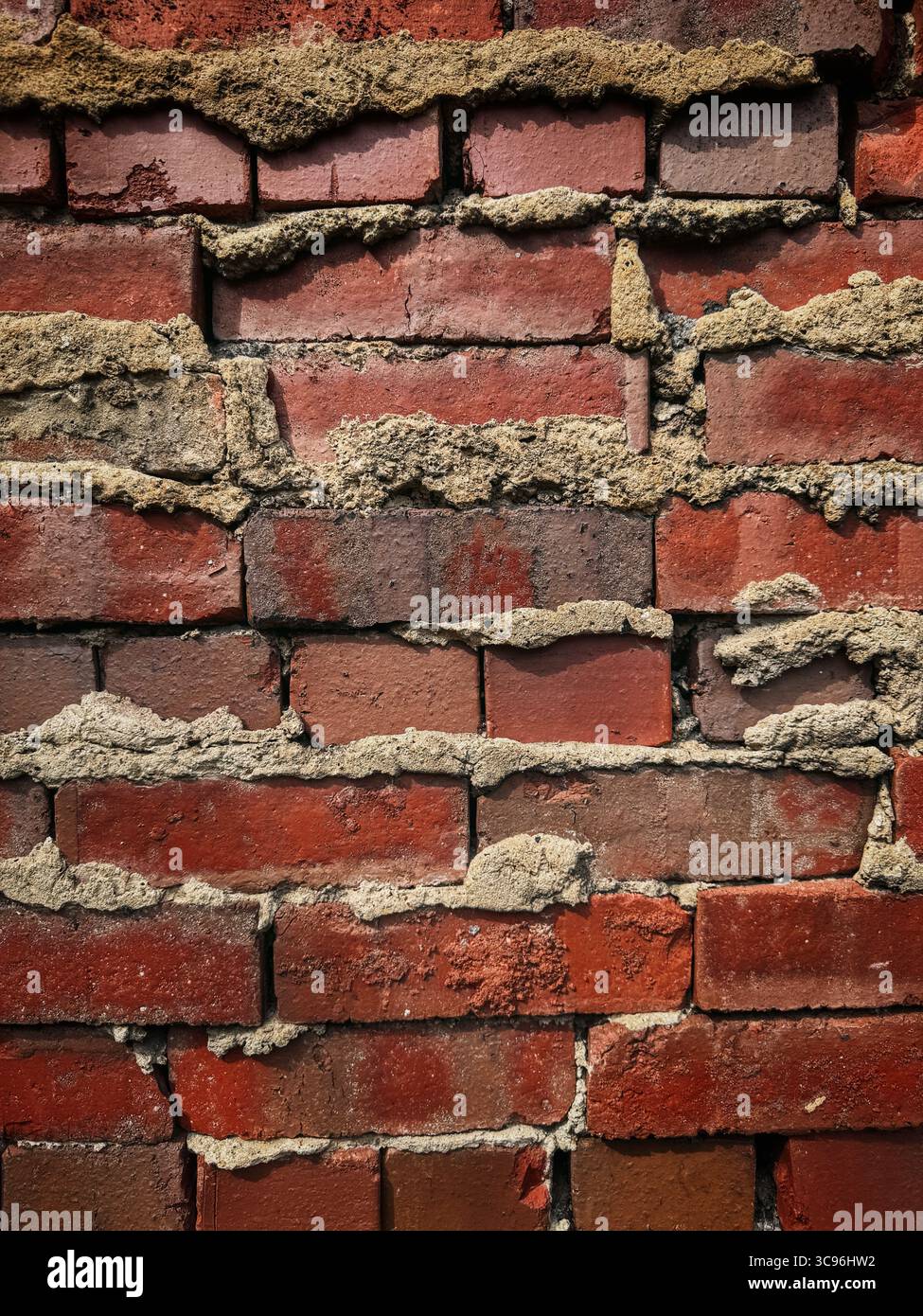 Wanddetails aus rotem Backstein - Smartphone-aufgenommenes Stockfoto