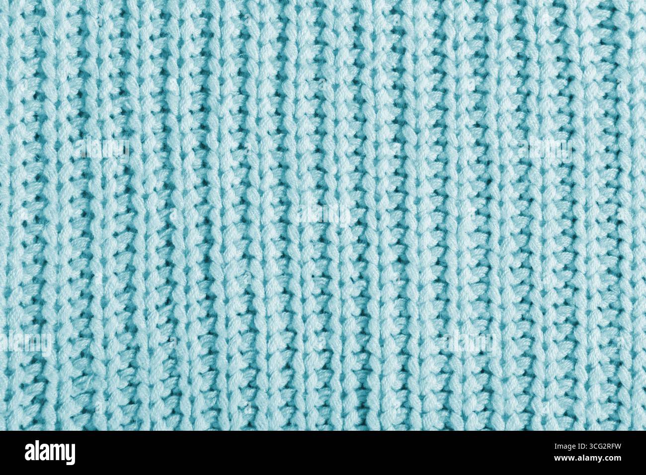 Blaue Textur eines großen Strickpullovers. Gestrickter Schal Hintergrund, winterlicher Textilinhalt Stockfoto