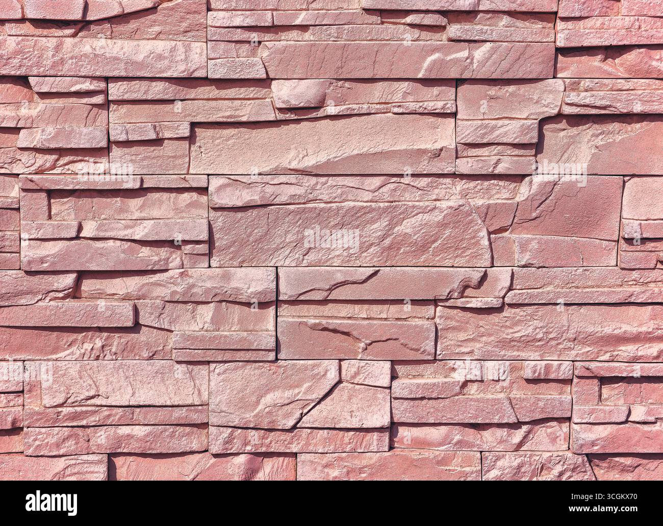 Strukturierter rosafarbener Steinwand-Hintergrund – hochauflösendes rustikales Design für digitale Hintergründe, Fotografie, Webdesign, Marketingmaterialien und ansprechende Grafiken für kreative und kommerzielle Zwecke Stockfoto