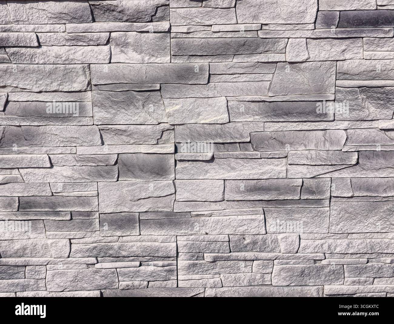 Steinwand-Textur: Vielseitiger grauer Hintergrund für digitale Hintergründe, minimalistisches Design, Social-Media-Grafiken, Fotografie, Marketing, Inspiration für Hintergrundbilder und kreative Werbeaktionen in allen Branchen Stockfoto