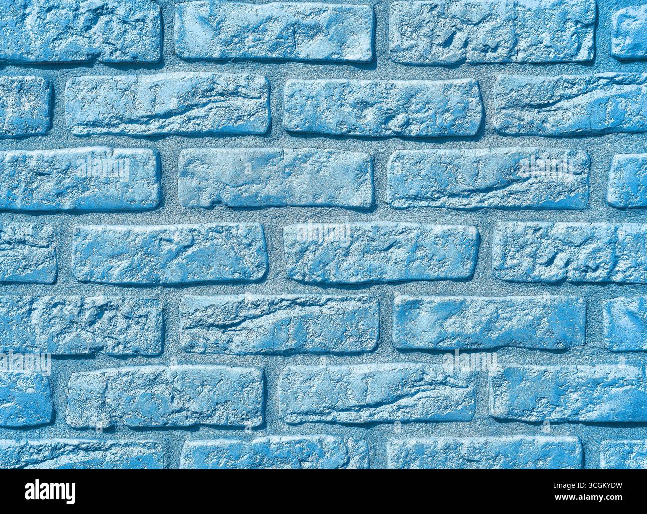 Blue Stone Wall Texture: Lebendiger und moderner Hintergrund für digitale Hintergründe, minimalistisches Design, Webnutzung, Fotografie, Marketingkampagnen, und kreative Projekte in verschiedenen Branchen Stockfoto