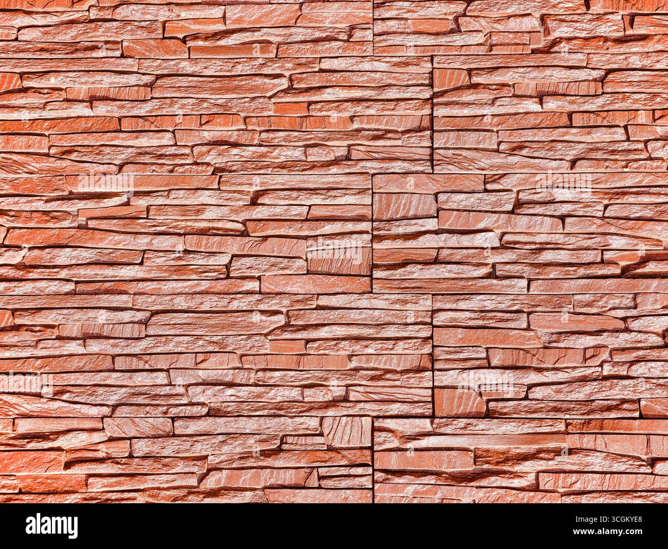 Rote Steinwand-Textur: Lebendiger und moderner Hintergrund für digitale Hintergründe, minimalistische Hintergrundbilder, Fotografie, Social-Media-Grafiken, Marketing, und kreative Werbeaktionen in allen Branchen Stockfoto