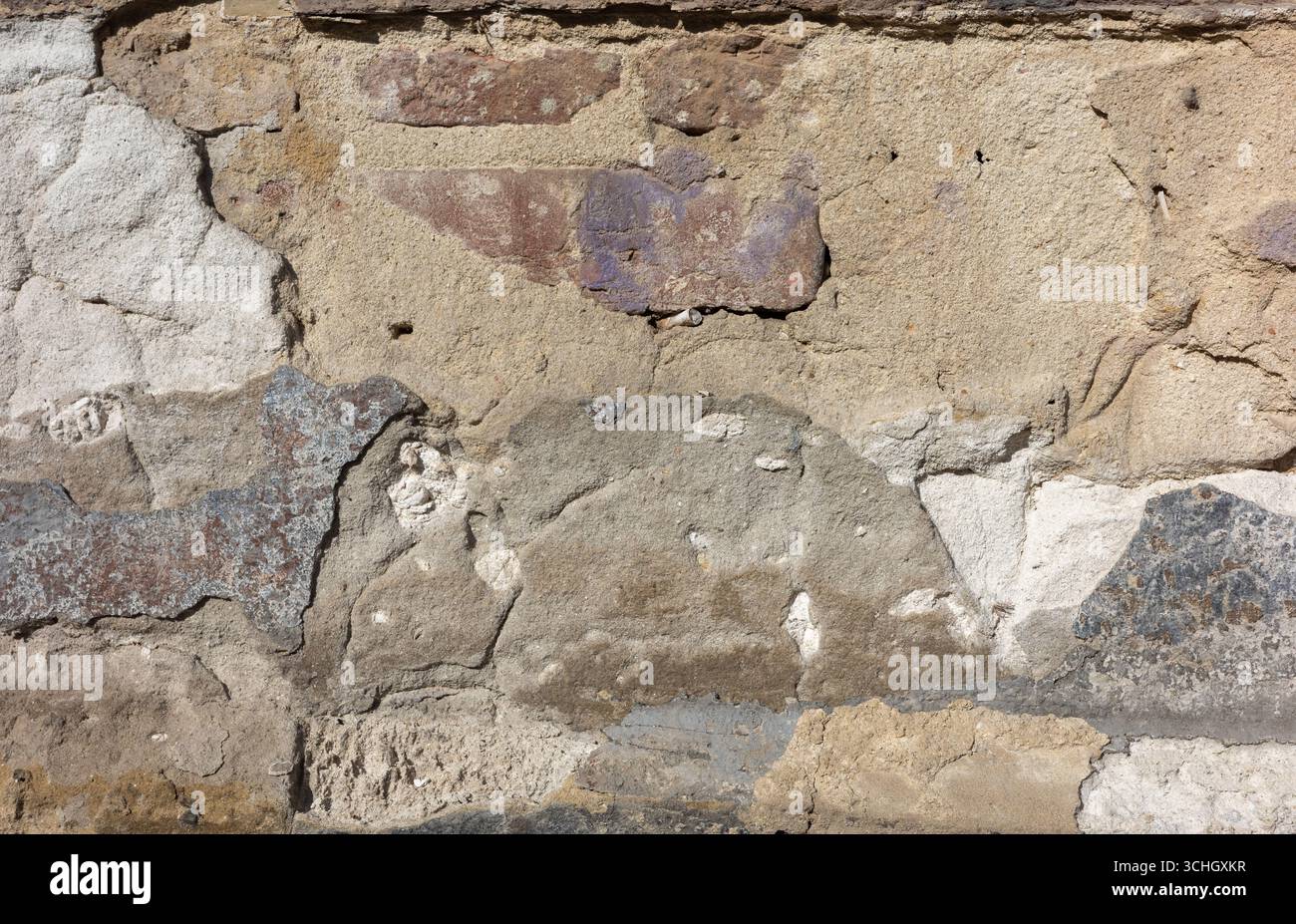 Abstrakte Textur einer alten Wand. Hintergrund mit rauen Oberflächen. Stein- und Gipsdetails. Stockfoto