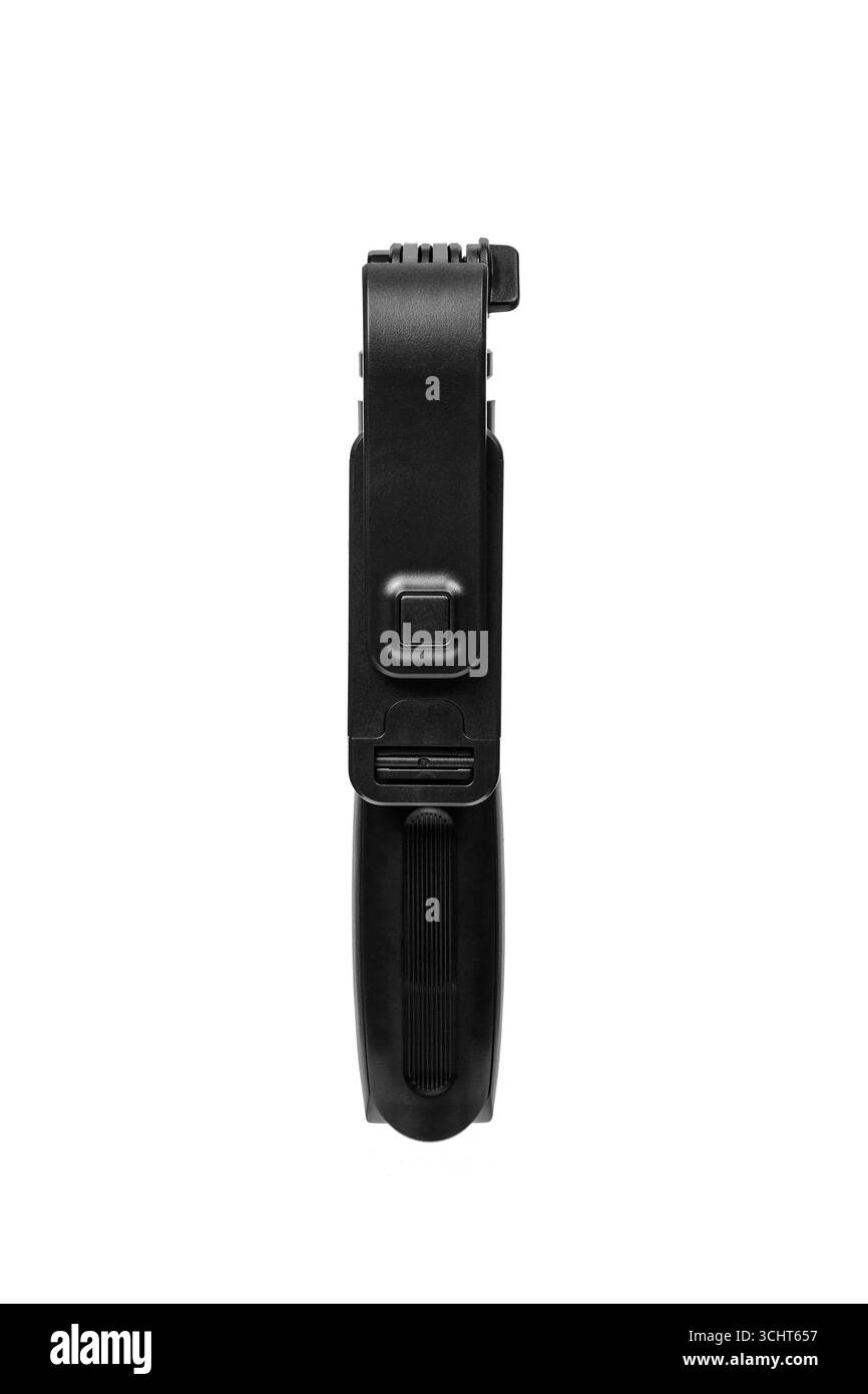 Ein schlankes, schwarzes, gefaltetes Mini-Stativ mit Telefonhalterung. Stockfoto