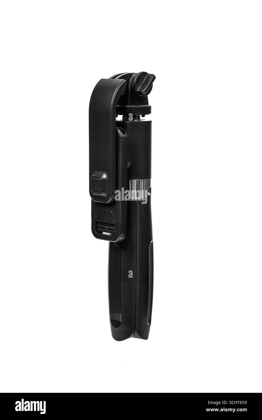 Ein schlankes, schwarzes, gefaltetes Mini-Stativ mit Telefonhalterung. Stockfoto