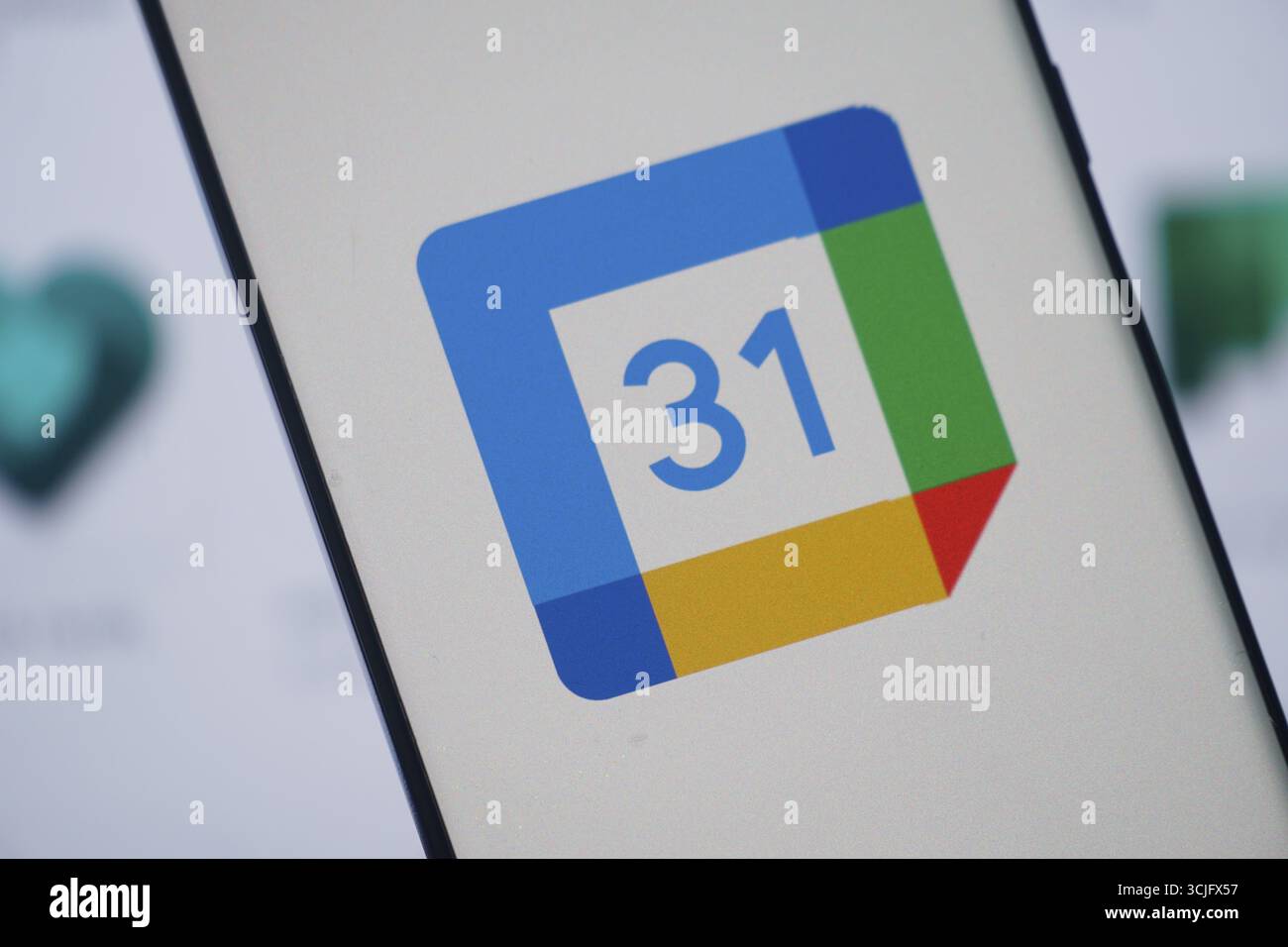 Google Kalender App-Symbol mit blauen, roten, grünen und gelben Farben auf einem Smartphone-Bildschirm Stockfoto