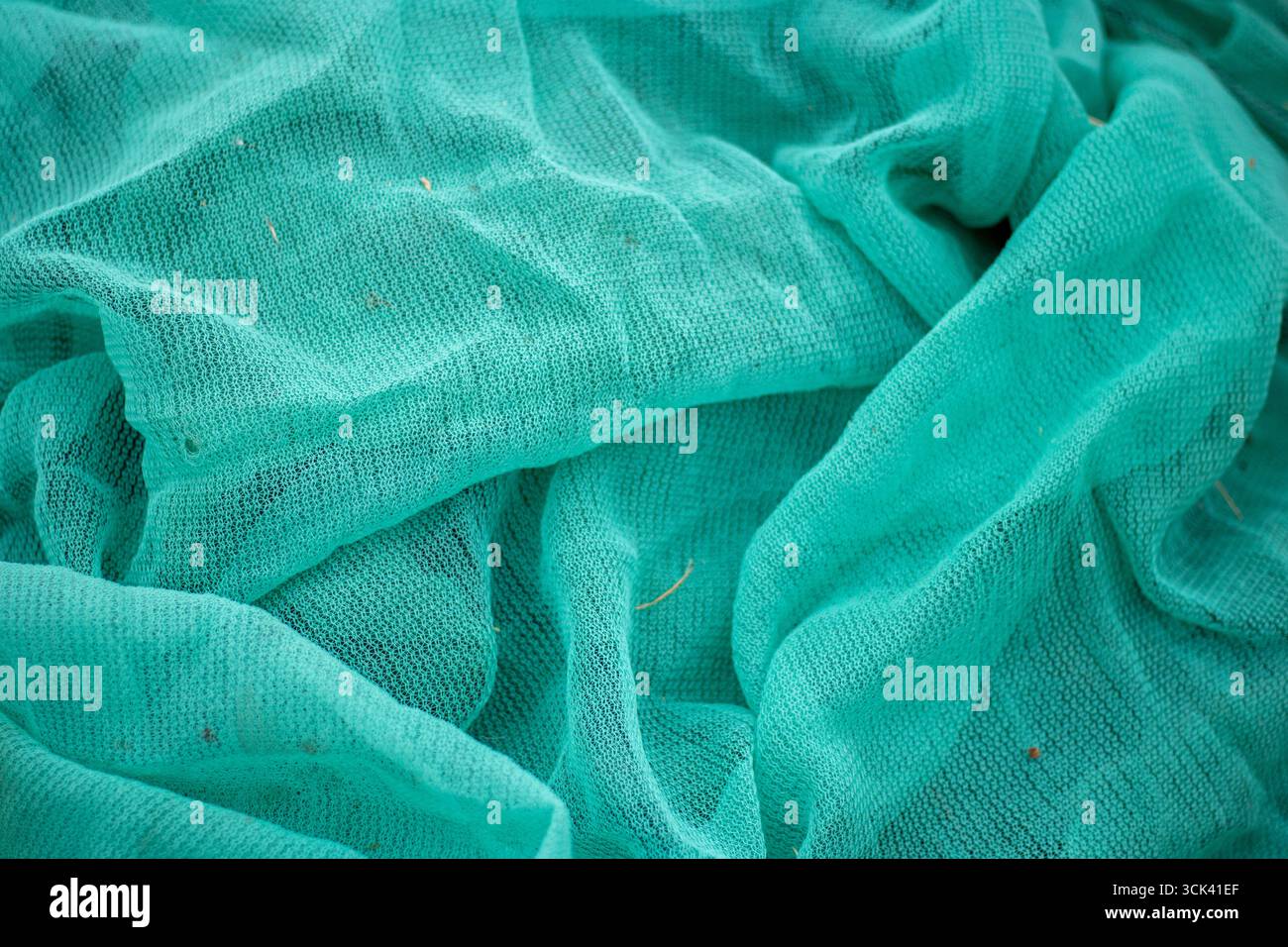Haufen von blasskalkgrünem Schattentuch Stockfoto