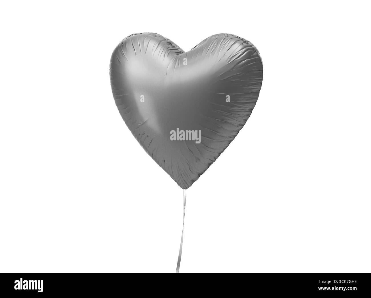Ein glänzender silberner Ballon in Herzform, der auf einer dünnen Schnur schwebt und Liebe und Feier symbolisiert. Stockfoto