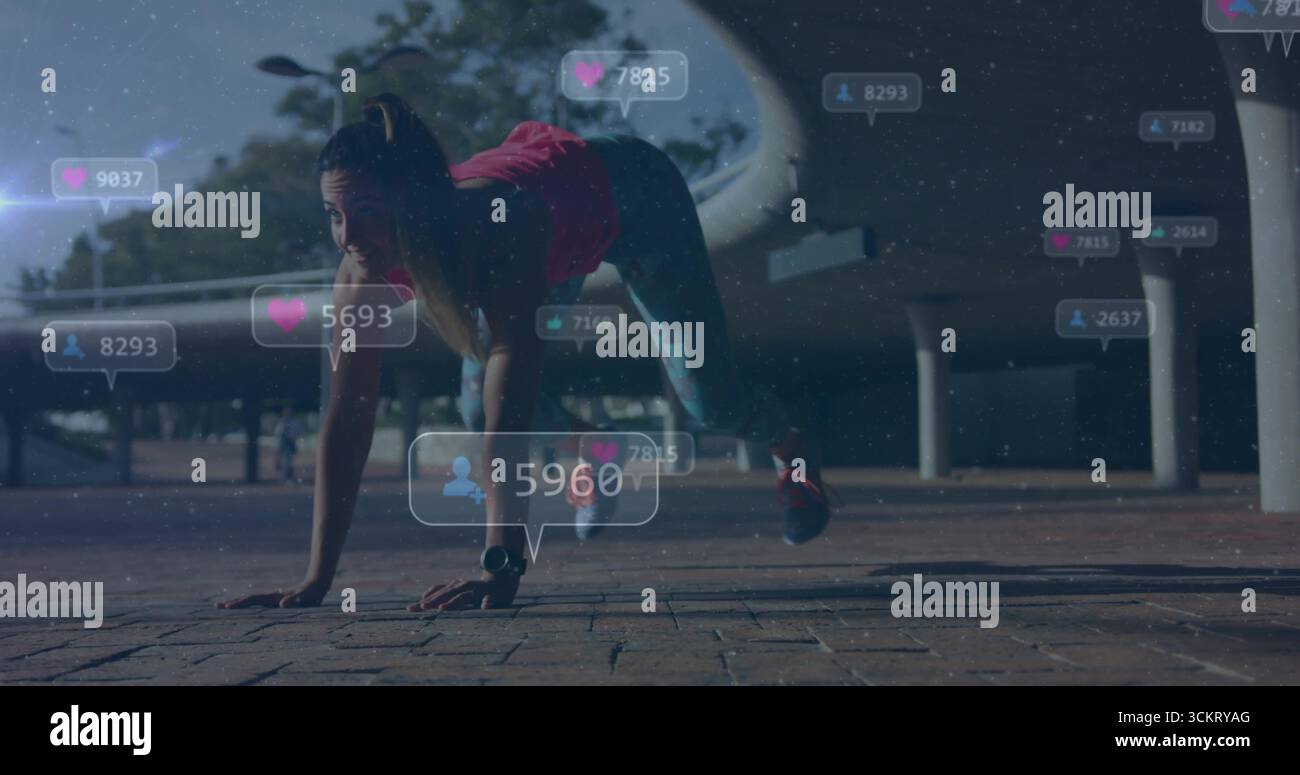 Sportler in Ausrüstung, die Bergsteiger auf dem Brick plaza mit Fitness-Tracker und Social-Media-Ikonen aufführen Stockfoto