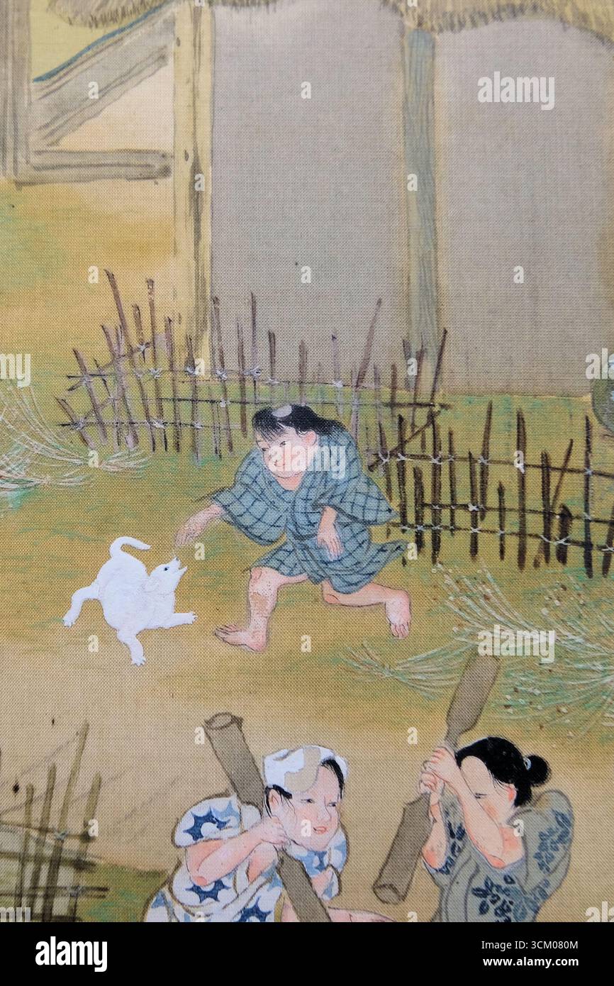 Detail aus Szenen in und um Kyoto von Sumiyoshi Gukei, Edo-Zeit, 17. Jahrhundert; Tokyo National Museum, Japan; Junge spielt mit Hund, Kind. Stockfoto