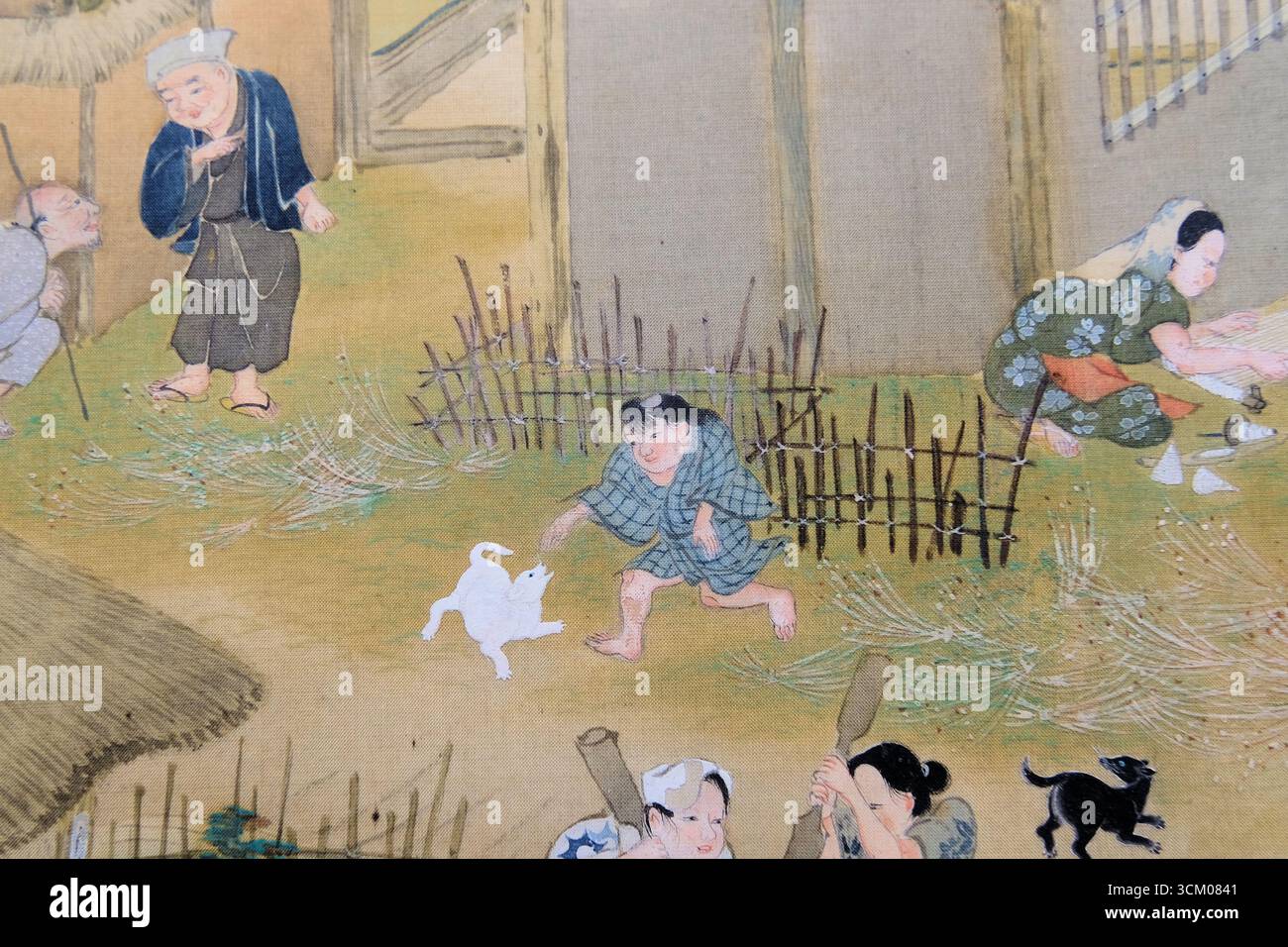 Details aus Szenen in und um Kyoto von Sumiyoshi Gukei, Edo-Zeit, 17. Jahrhundert; Tokio Nationalmuseum, Japan. Junge spielt mit Hund, Kind. Stockfoto