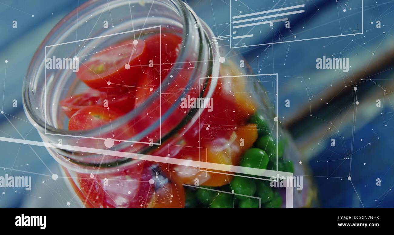 Zeigt ein Glasgefäß mit bunten Süßigkeiten auf blauer Tischplatte mit digitalen HUD-Überlagerungen Stockfoto