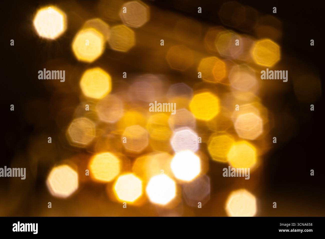 Goldene Bokeh Lichter Hintergrund. Goldene Bokeh-Tapete. Stockfoto