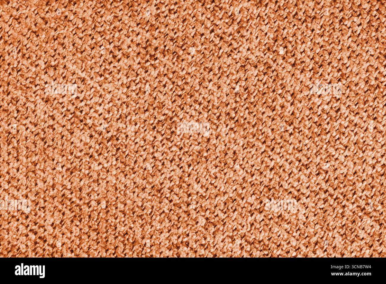 Makrofoto von orangenem Textilgewebe, Polstermaterial, Stoff mit detaillierter Textur und Muster. Perfekt für Textildesign, Hintergrund und Rückseite Stockfoto