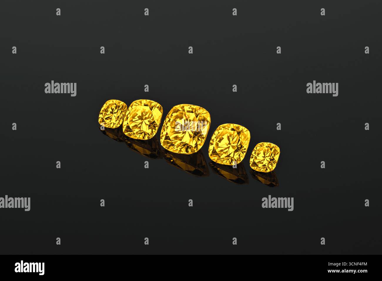 Eine Nahaufnahme von fünf gelben Edelsteinen. Die Steine haben alle unterschiedliche Größen und sind in einer Reihe angeordnet Stockfoto