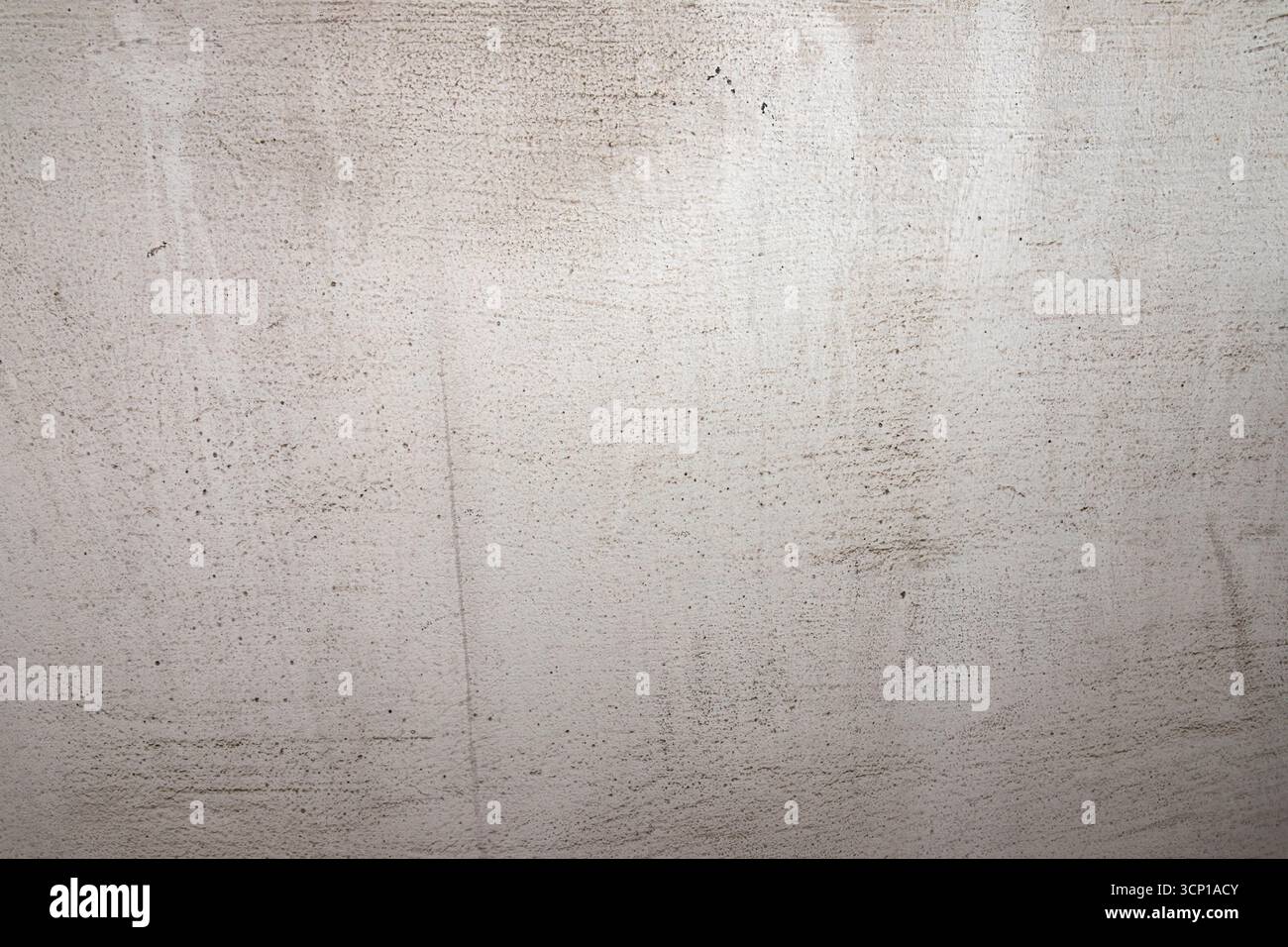 Grauer Hintergrund mit strukturierter Oberfläche. Minimalistischer abstrakter Hintergrund für Design-, Vorlagen-, Präsentations- oder Grafikprojekte. Stockfoto