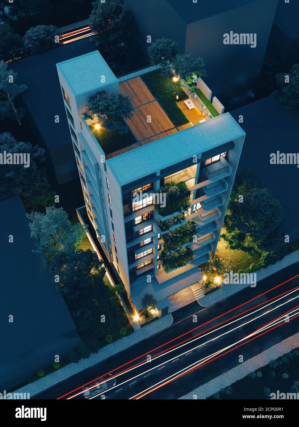 Moderner Urban Residence Tower mit beleuchtetem Grün und Straßenbeleuchtung Stockfoto