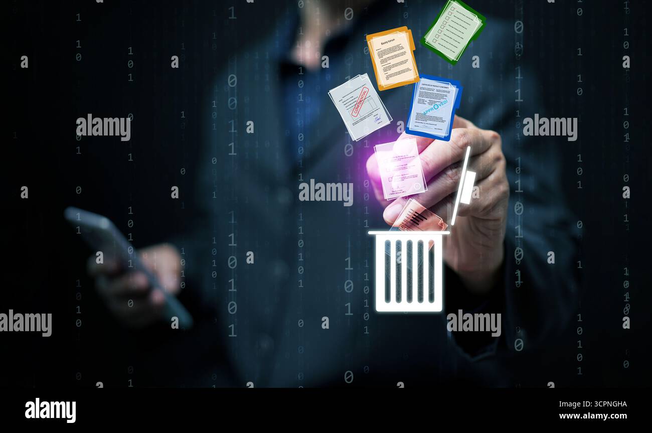 Ein Mann, der mit der Hand farbenfrohe digitale Dateien in einen leuchtenden Papierkorb löscht, steht für sichere Datenentfernung, Dokumentenverwaltung, Cybersicherheit und Moderne Stockfoto