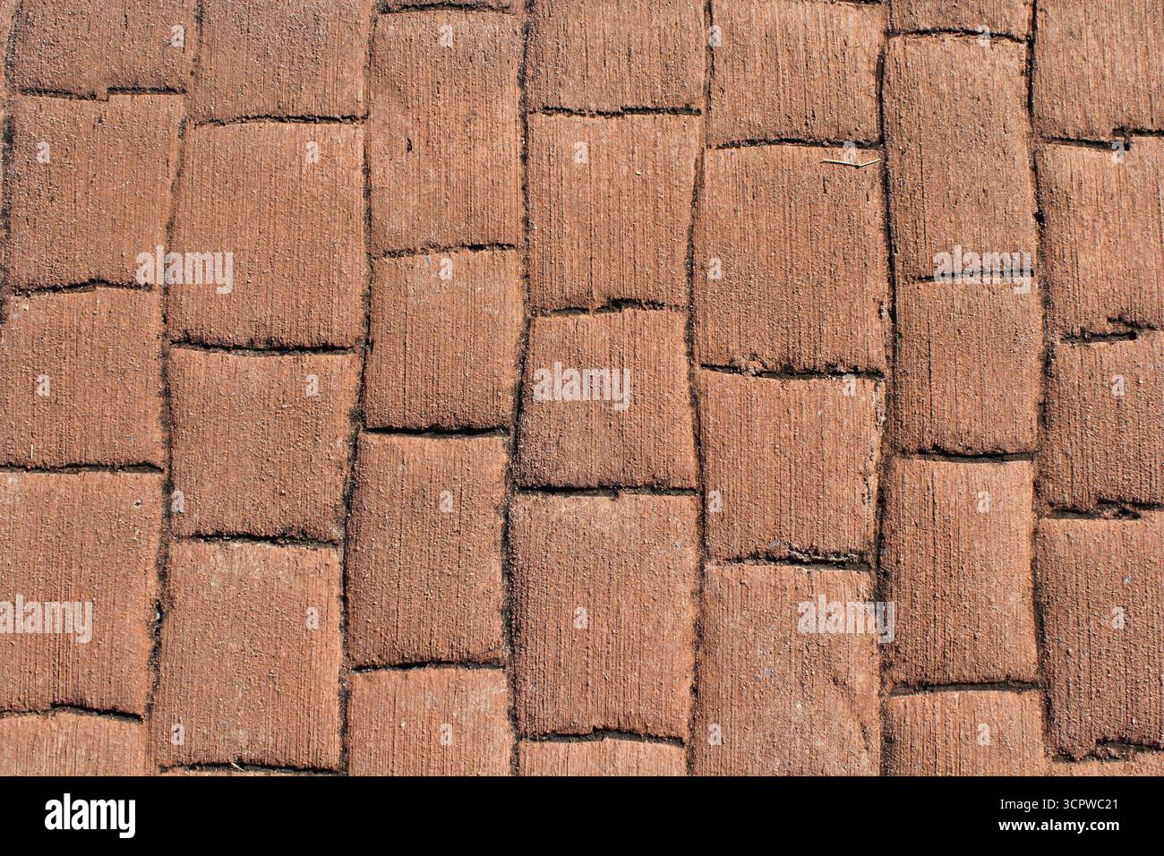 Verwitterter rötlich-brauner Backsteinoberfläche abstrakt strukturierter Hintergrund Stockfoto