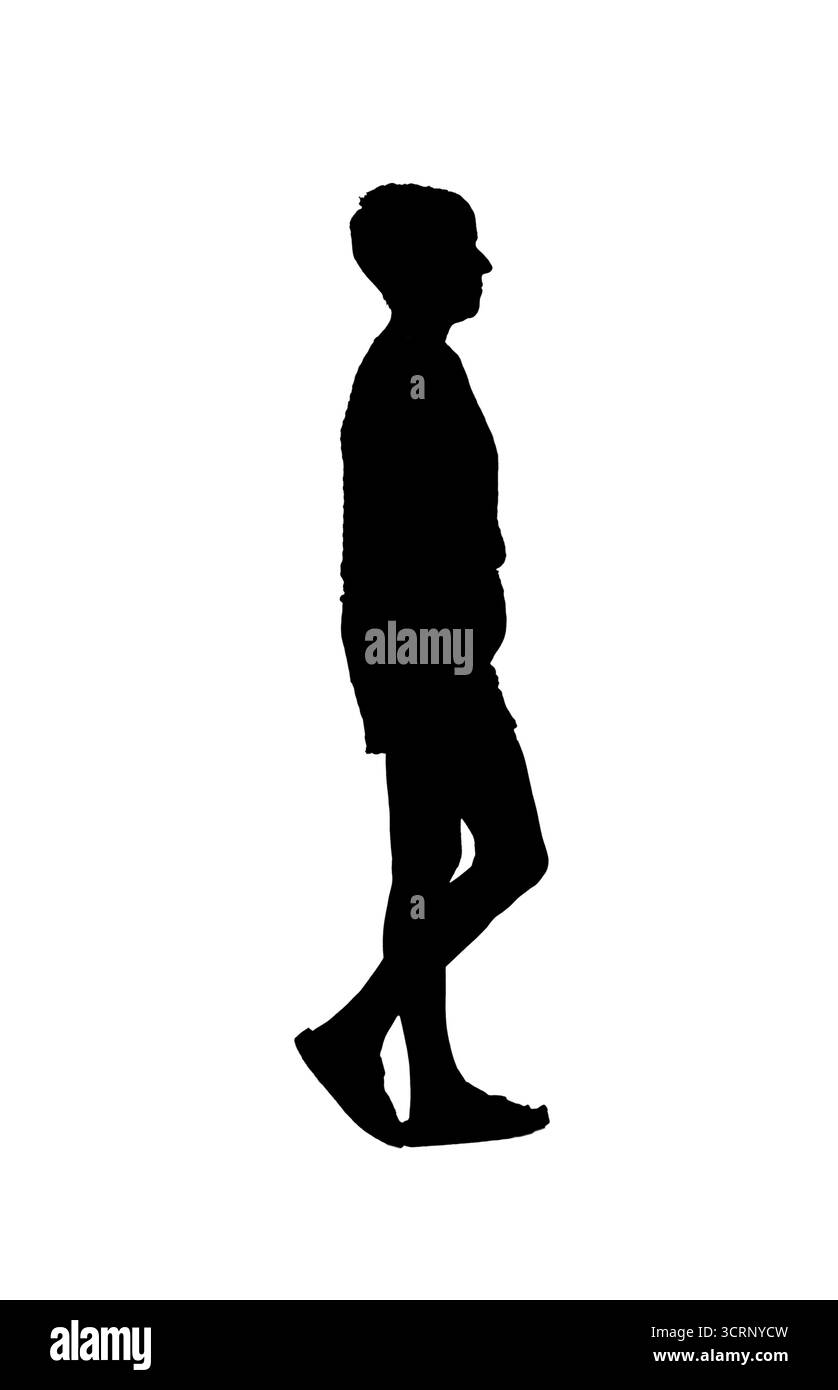 Silhouette der Seitenansicht einer Frau in Shorts und Sandalen Stockfoto