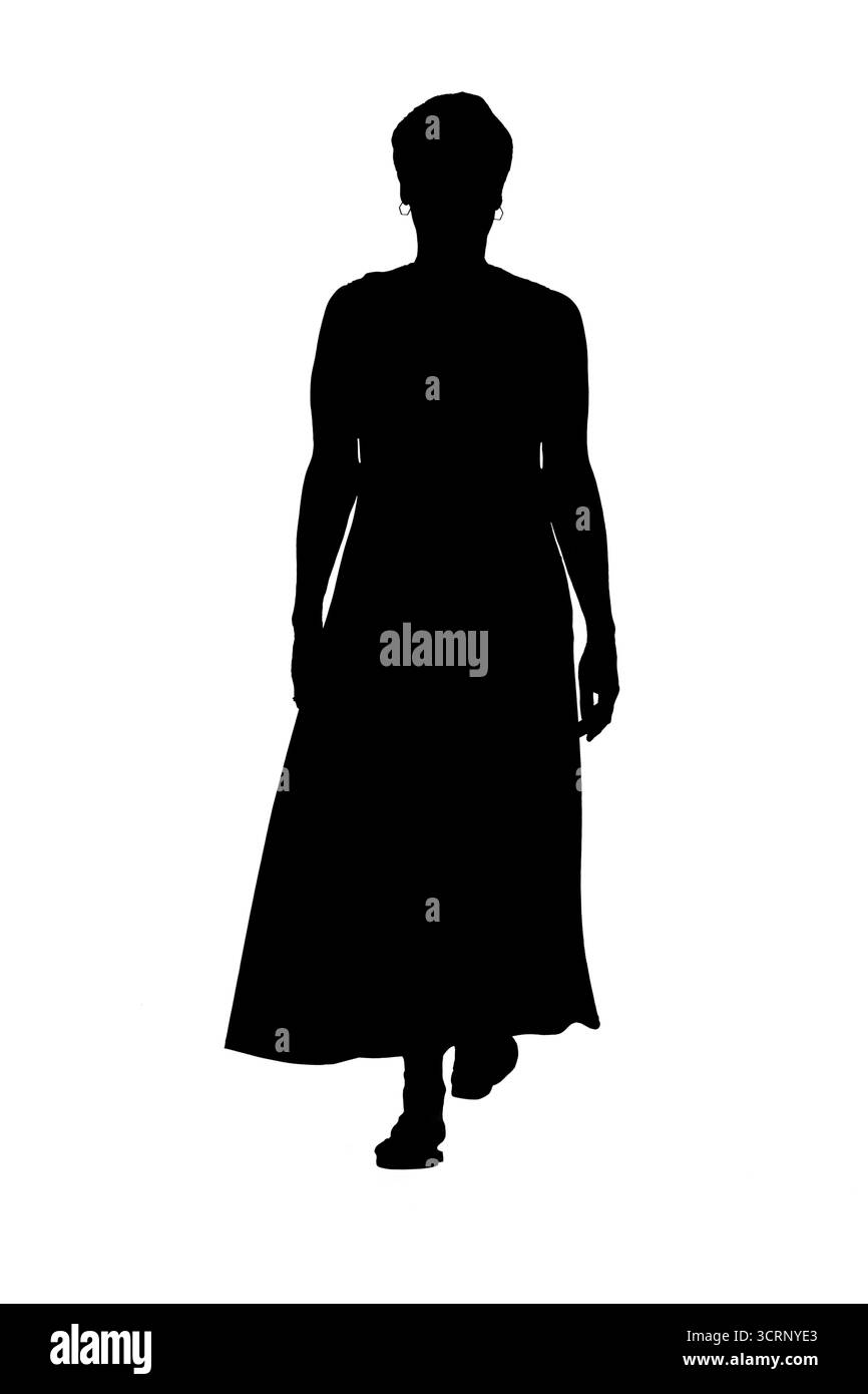 Silhouette der Rückansicht einer Frau in Kleid und Sandalen Stockfoto