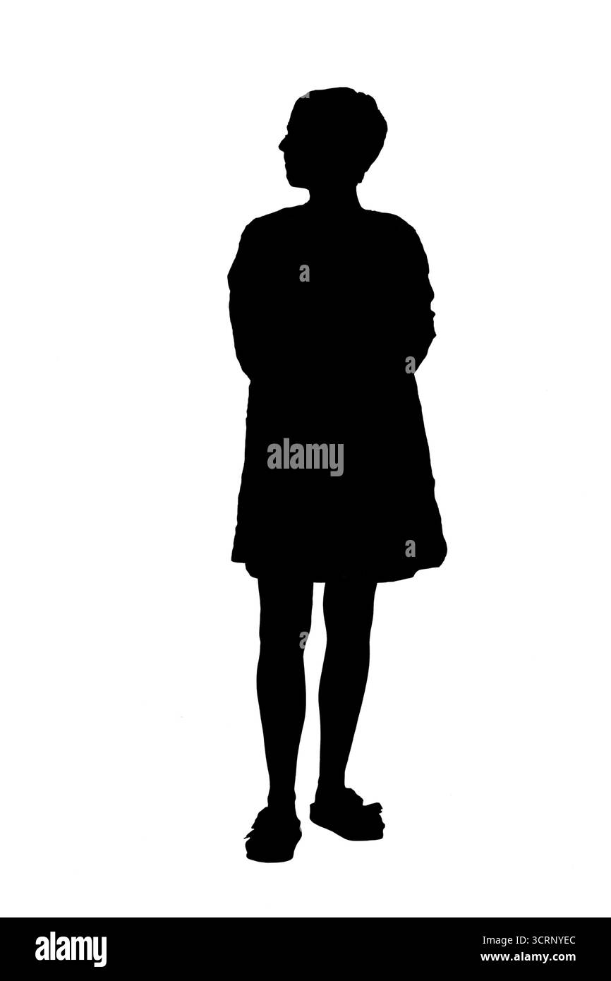 Die Silhouette der Arme der Frau, die in einem Sommerkleid wegblickt Stockfoto