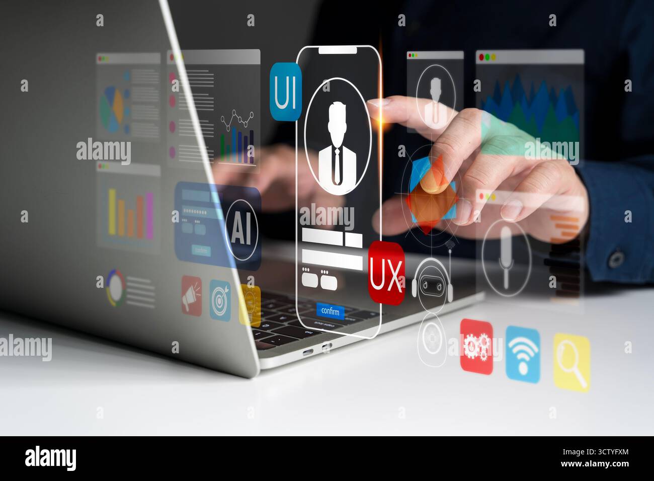 Kreativer UI-UX-Designer mit Laptop für die Entwicklung digitaler Schnittstellen mit KI-Technologie, Datenvisualisierung und Innovation mobiler Apps Stockfoto