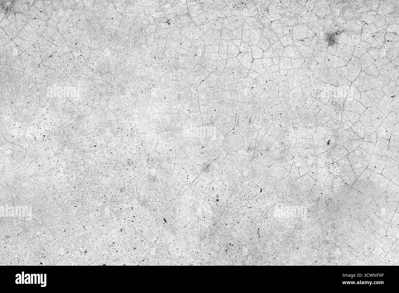 Grauer Hintergrund mit gerissener Betonwandstruktur mit rauer Oberfläche und natürlichen Details, perfekt für Industrie- oder Grunge-Designprojekte. Stockfoto