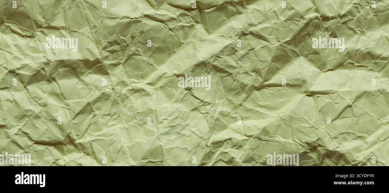 Zerknittertes grünes Papier mit Nahaufnahme zerknitterter Oberfläche Stockfoto