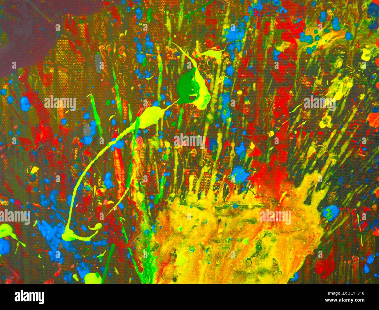 Abstrakt lebendiger Farben, die über die Leinwand gespritzt werden Stockfoto