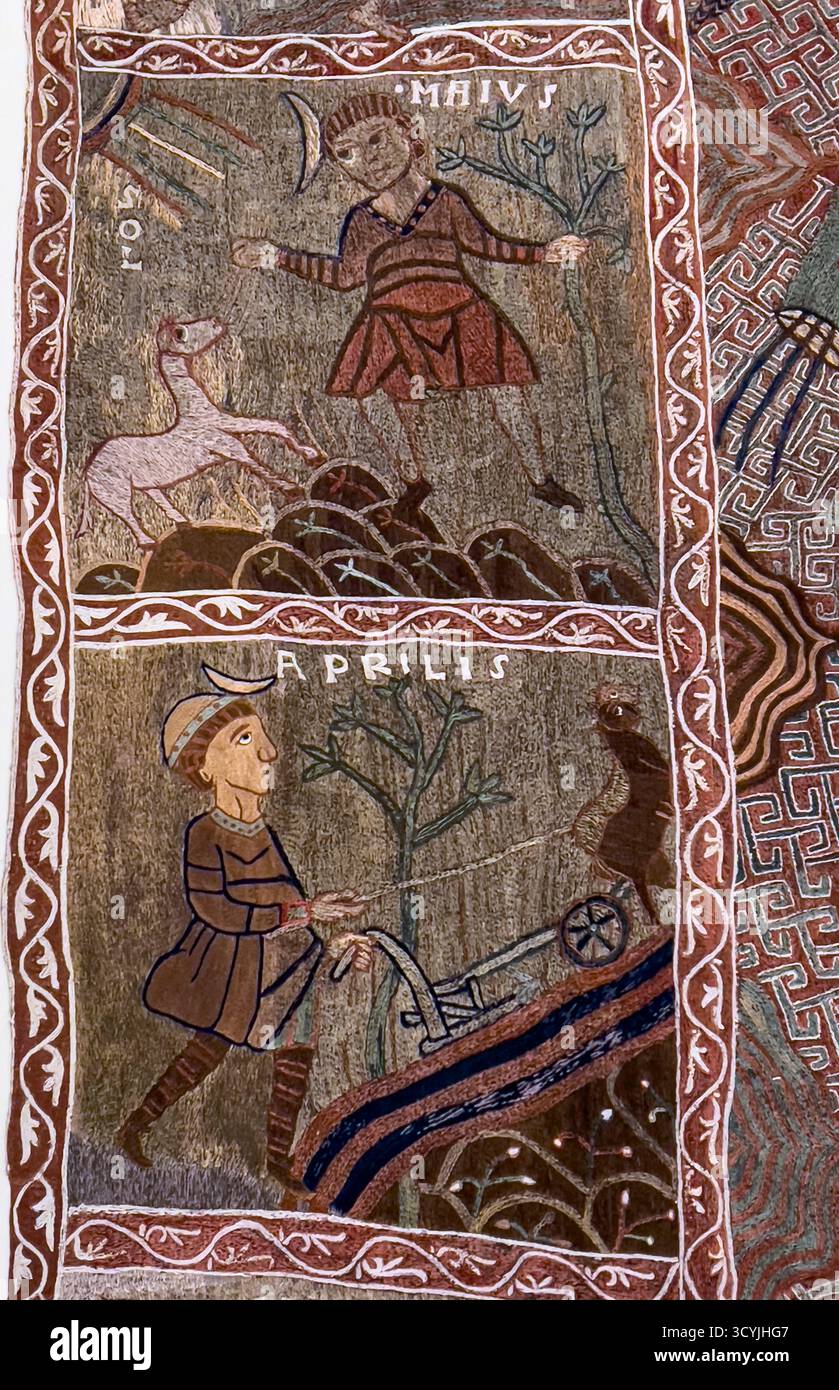 Zwei Tafeln aus dem 11. Jh. Creation Tapisry in der Kathedrale von St. Mary, Girona, zeigen das Pflügen im April und das Füttern von Pferden im Mai Stockfoto