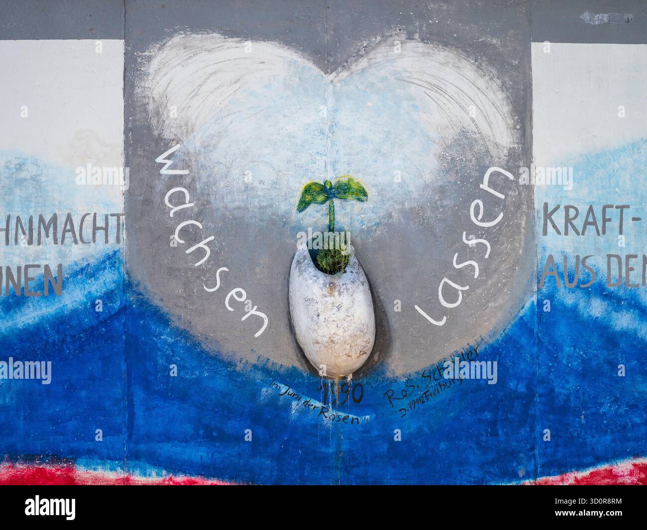 Deutschland, Berlin, Berlin East Side Gallery. Straßenkunst und Wandmalereien an der Berliner Mauer in der Gegend, die heute als Berlin East Side Gallery bekannt ist. Stockfoto