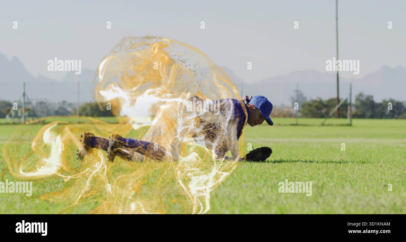 Weibliche Baseballspielerin taucht auf dem Grasfeld mit blauer Kappe, Trikot, Handschuh und goldenem Energiesprall Stockfoto