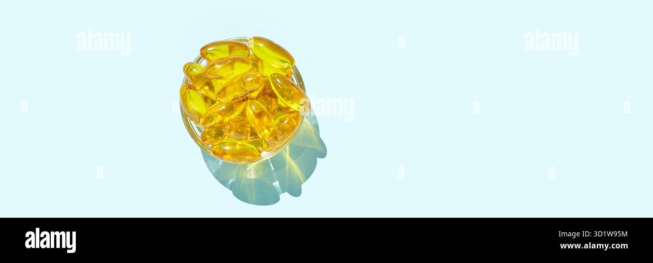 Omega3-Gelkapsel. Sonnenschatten. Gelbes Vitamin. Gesundheit Essen. Dietologie-Medikament Stockfoto
