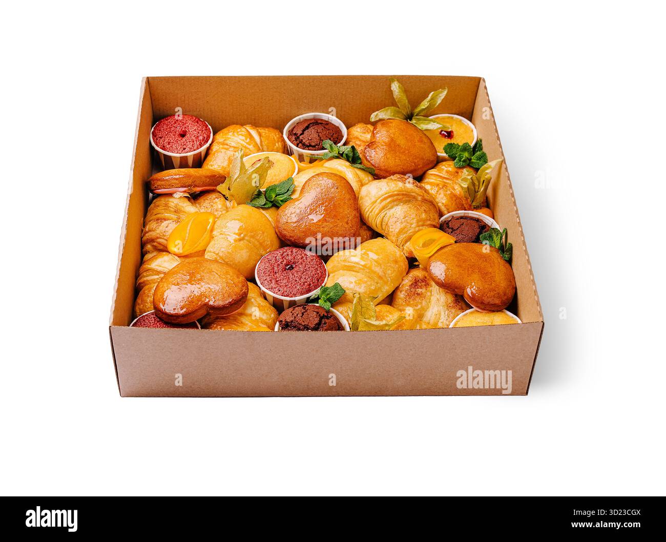 Köstliche Auswahl an frisch gebackenem Gebäck und Desserts in einer Box Stockfoto