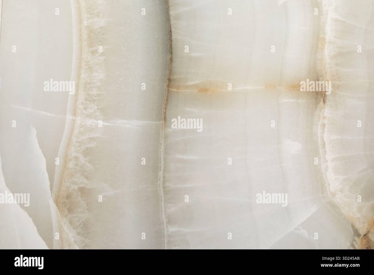 Oberfläche aus natürlichem Onyx-Stein mit komplizierten Mustern und sanften Farben, die einzigartige Textur und Schönheit zeigen Stockfoto