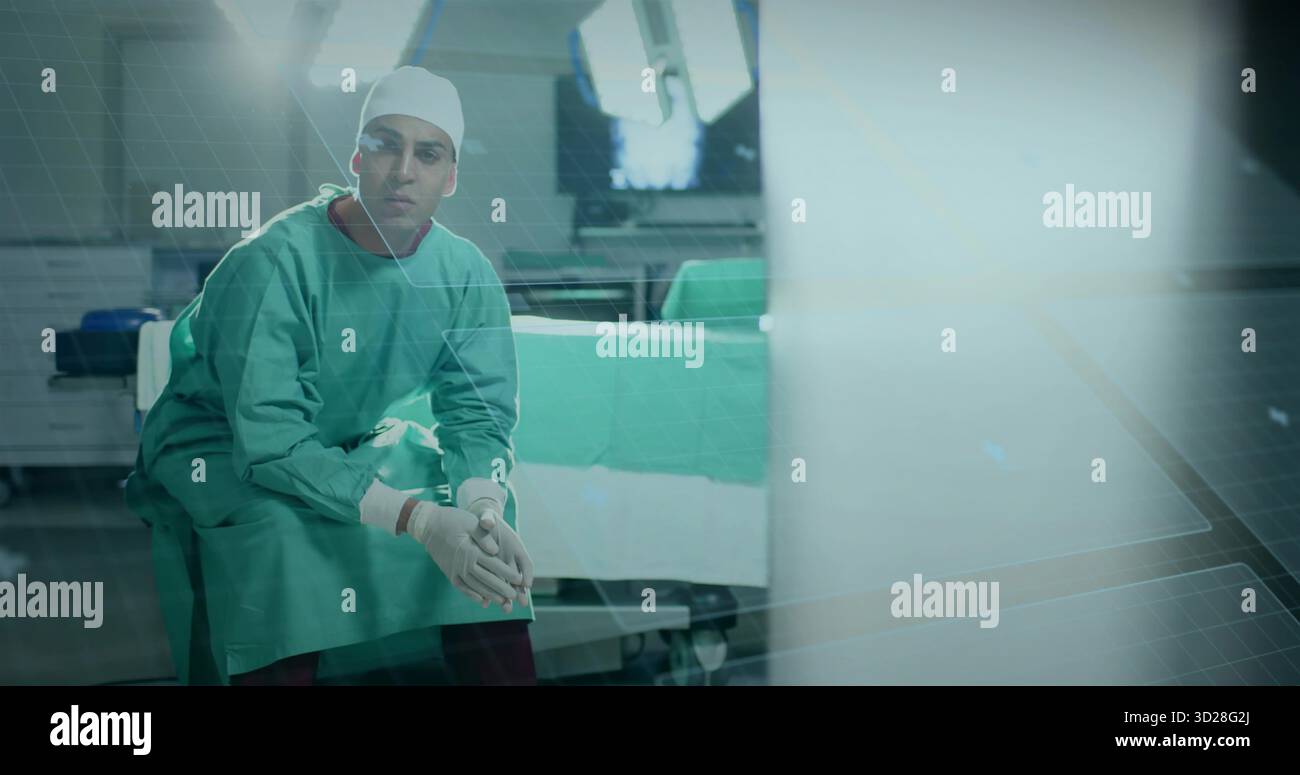 Sitzender Chirurg am OP-Tisch, mit Instrumententräger, Deckenleuchten, Monitor, Schränken Stockfoto