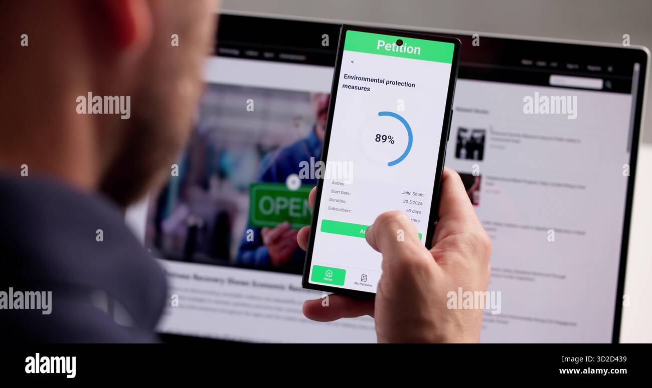 Mann Unterzeichnet Online-Petition Auf Smartphone-App Für Guten Zweck. Das Petitionsformular Wird Auf Dem Smartphone Ausgefüllt Stockfoto