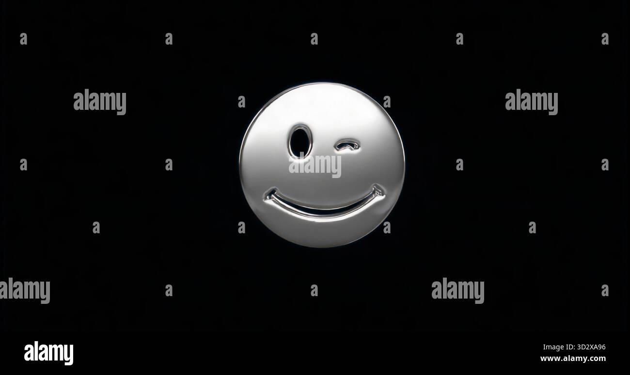 Glitzerndes silberfarbenes, blinkendes Smiley-Symbol mit dezenten Highlights auf schwarzem Hintergrund Stockfoto
