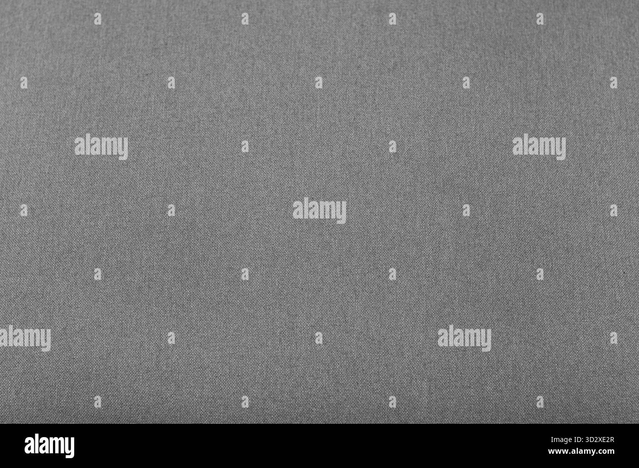 Nahtlose Textur des Stoffes für Polstermöbel in hellgrauer Farbe, natürliche Textilien, gewebte Fadenmatten, laute Struktur Stockfoto