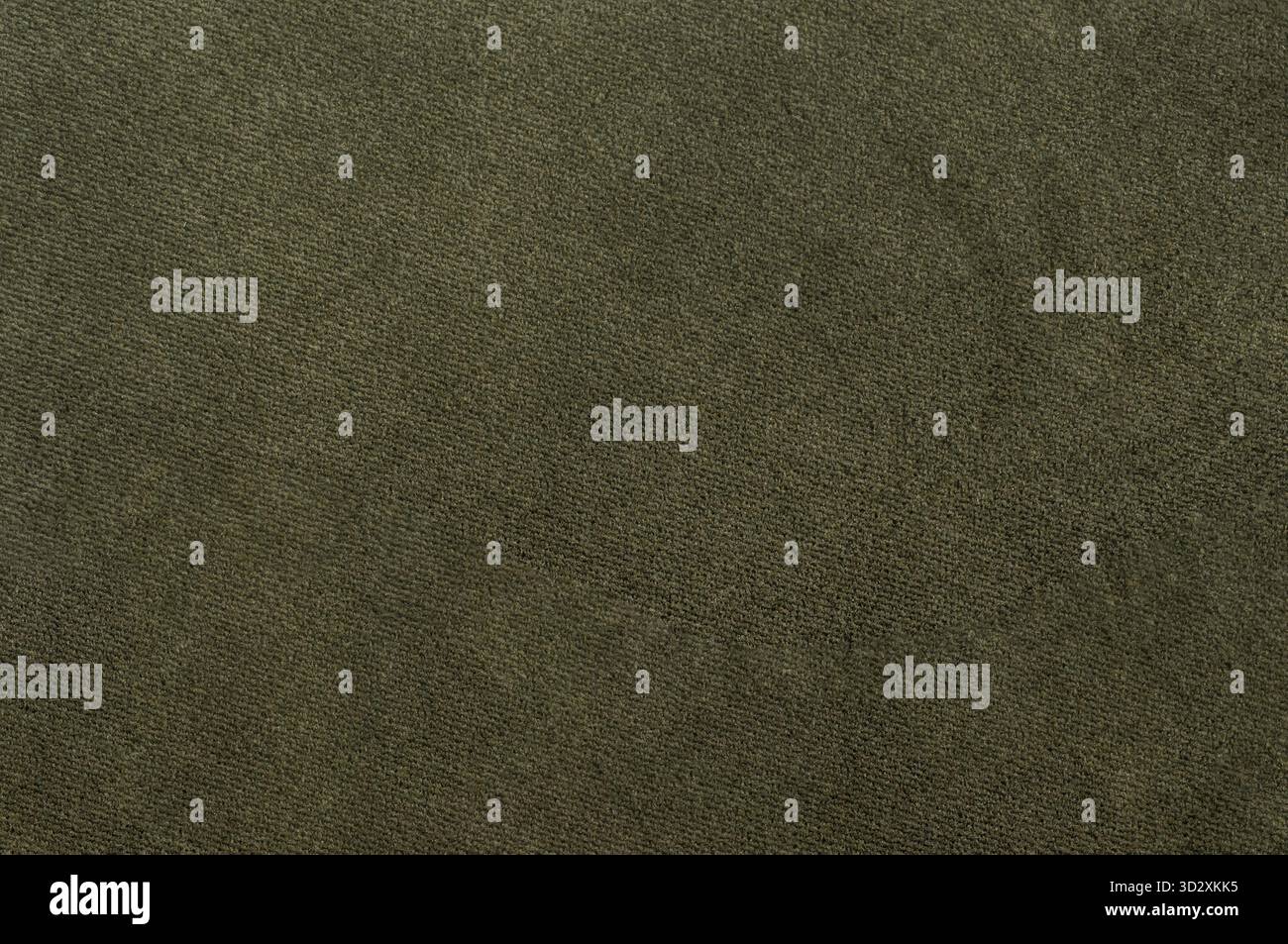 Textur aus olivem Velours mit weichen Fasern, detaillierte Nahaufnahme aus Textilmaterial Stockfoto