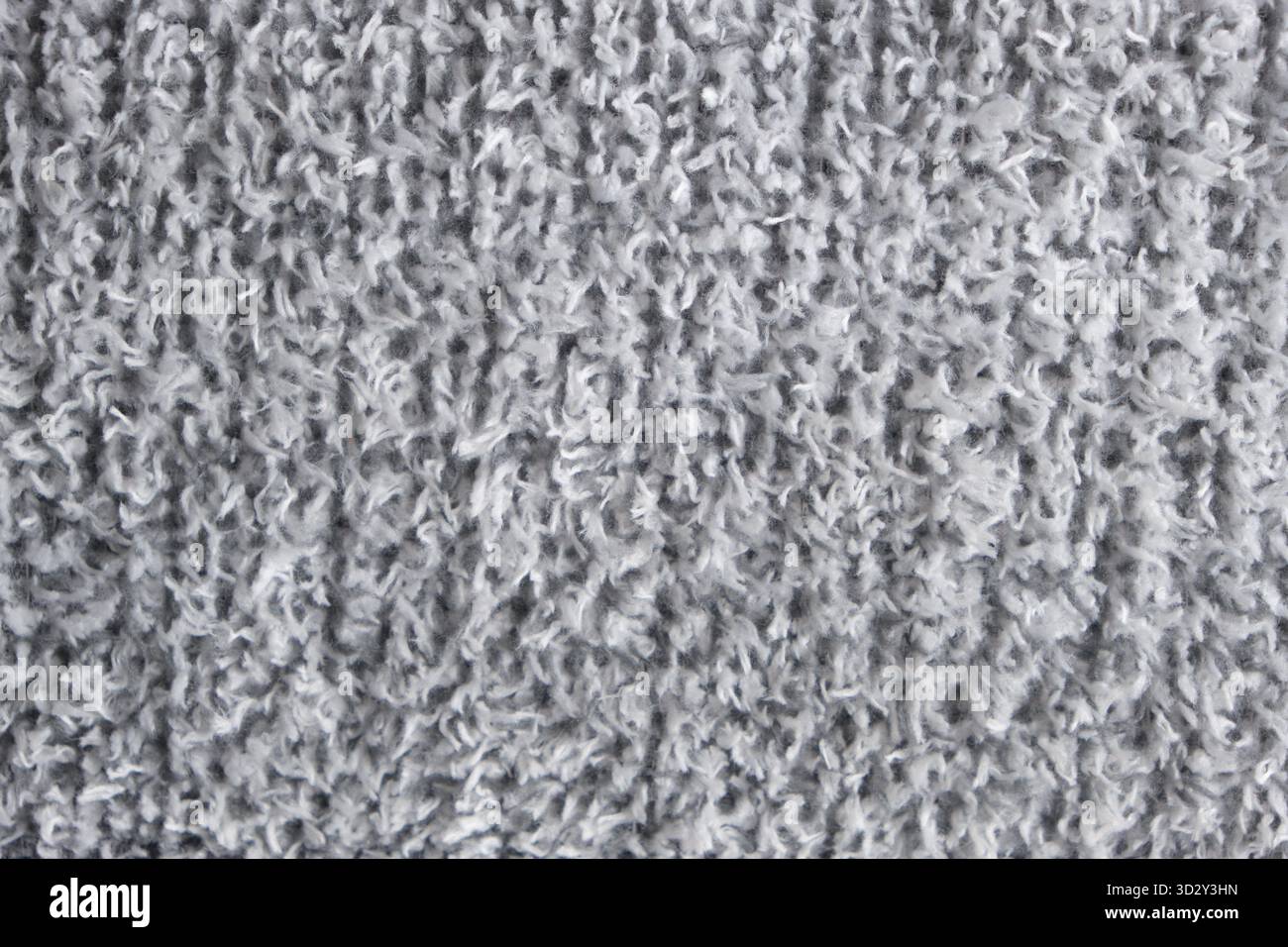 Textur des grauen Teppichs als Hintergrund, Nahaufnahme. Innenarchitektur Stockfoto