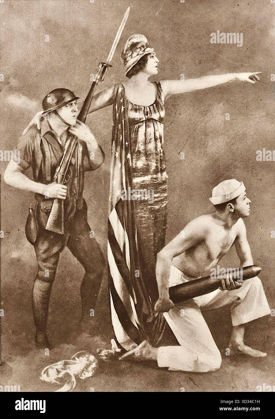Ben Ali Haggin – US-amerikanischer Porträtmaler und Bühnenbildner. Bekannt wurde er durch seine Porträts prominenter Gesellschafterinnen und Theaterdarstellerinnen sowie durch die Gestaltung von „Tableaux vivants“ (lebende Bilder) für die Ziegfeld-Follies von 1917 bis 1925. Das zur Verfügung gestellte Bild ist ein Foto eines solchen patriotischen Tableaus mit dem Titel America Answers, das von Haggin arrangiert wurde. Die Schauspielerin Ethel Barrymore ist die Hauptfigur der Liberty. Dieses spezielle Tableau war Teil einer Serie, die für Propaganda oder Spendenaktionen verwendet wurde, wie zum Beispiel das nationale Rote Kreuz-Pageant 1917 und Liberty Loan Stockfoto