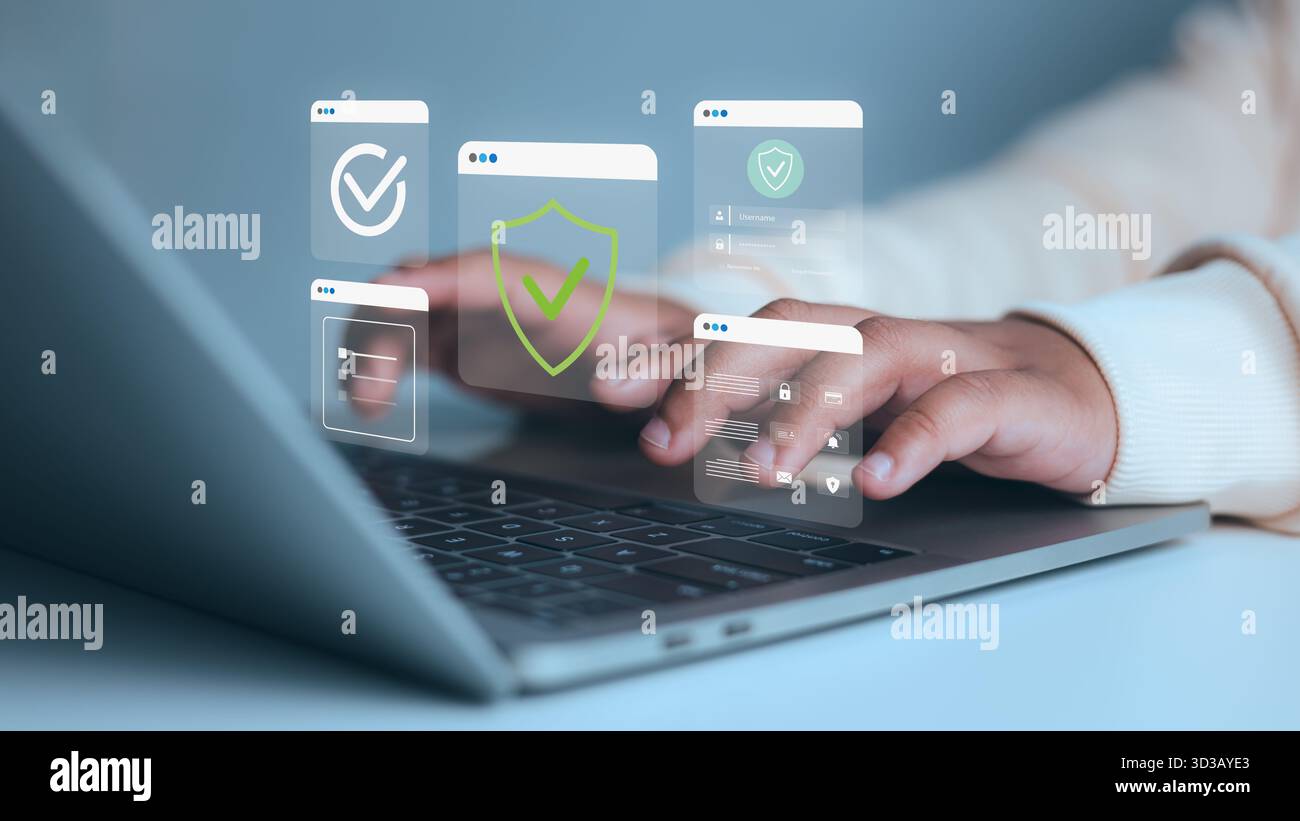 Handtippen auf einem Laptop mit digitalen Sicherheitssymbolen, Abschirmmarkierung und Anmeldeschnittstelle, Konzept der Cybersicherheit, Online-Datenschutz und Datenschutz Stockfoto