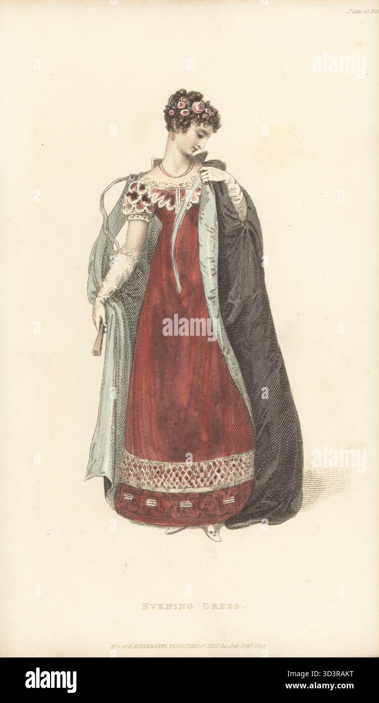 Frau im Abendkleid für einen Abend in der Oper. Kleid aus Granatapfelkrepp lisse, verziert mit Stahlperlen und Satin-Rouleau. Schwarzer Opernmantel aus Satin, mit blauem Sarsnet gesäumt. Handkolorierter Kupferstich von Thomas Uwins alias Arbiter Elegantiarum aus Rudolph Ackermanns Repository of Arts, Strand, London, Februar 1823. Stockfoto