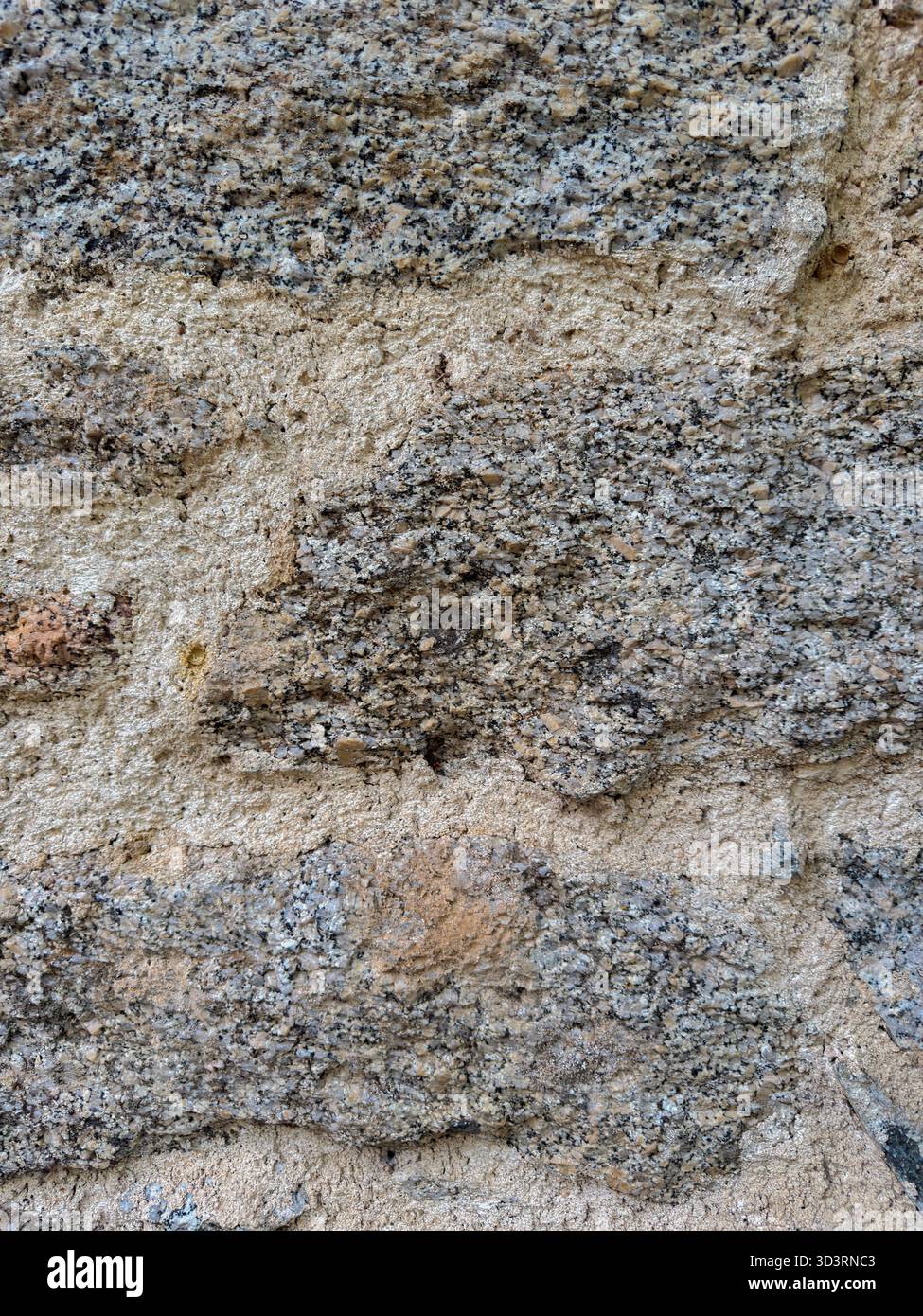 Granitstein-Wandstruktur Nahaufnahme der rauen Oberfläche Stockfoto