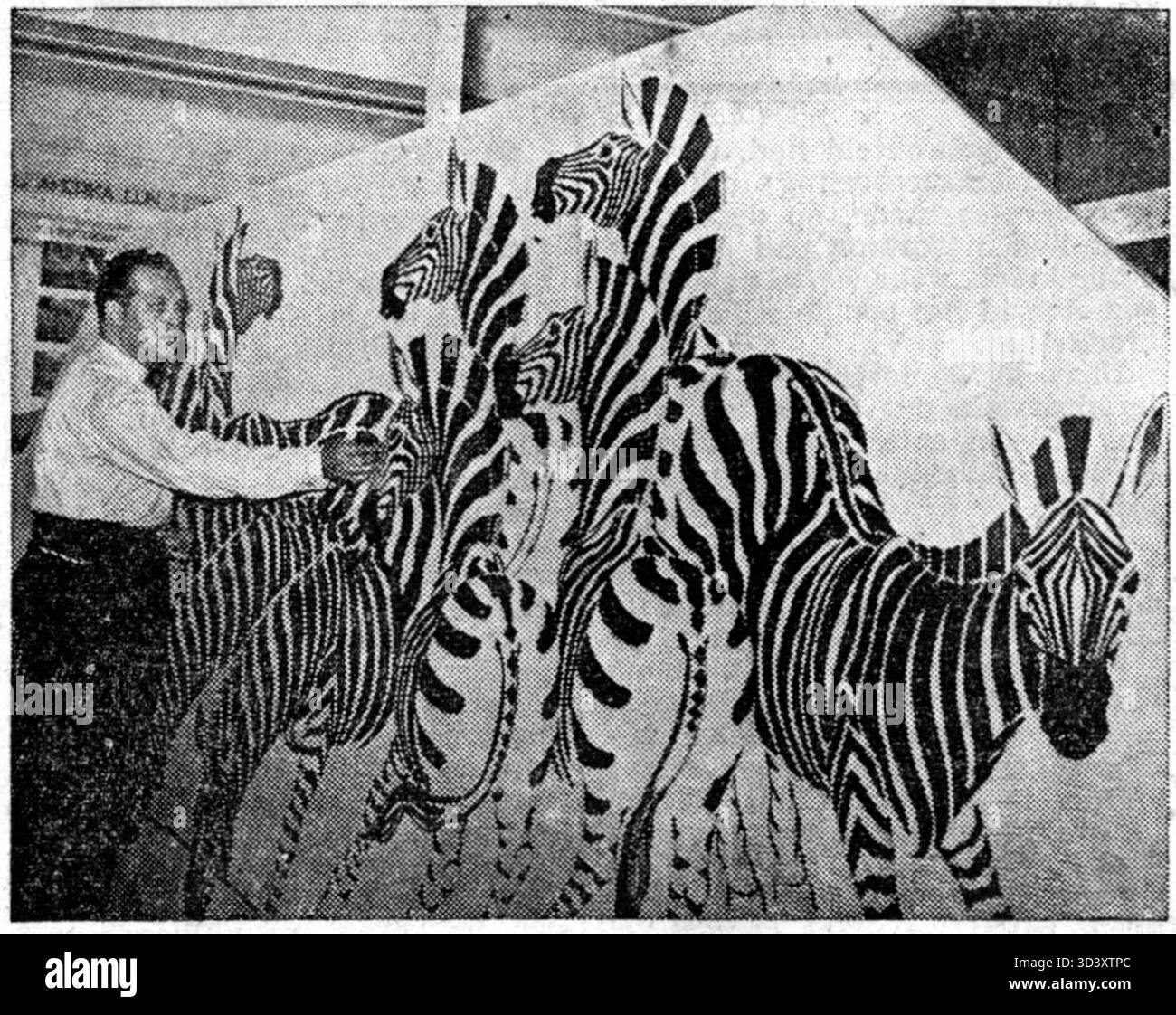 Smith Le Roux arbeitet 1949 an Wandmalereien für das Gebiet Jagersfontein. Das Foto zeigt ihn, wie er großformatige Wandkunst kreiert. Stockfoto