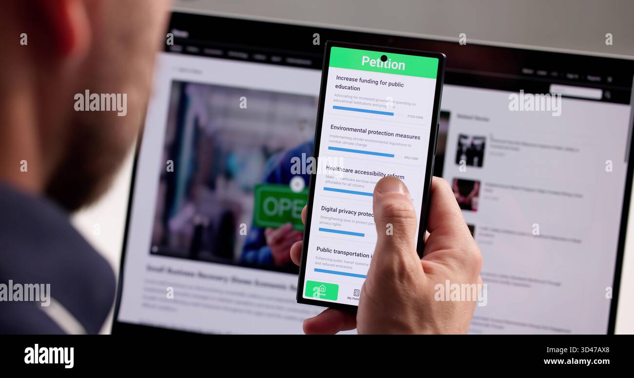Mann Unterzeichnet Online-Petition Auf Smartphone-App Für Guten Zweck Stockfoto