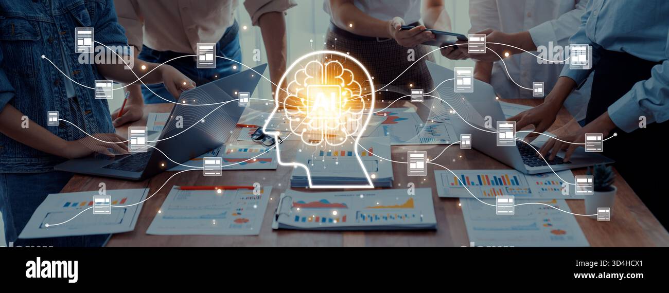 Ein dynamisches Geschäftsteam arbeitet in einem modernen Arbeitsbereich zusammen und nutzt innovative Technologien und Datenanalysetools, um Kreativität und Kreativität zu fördern Stockfoto