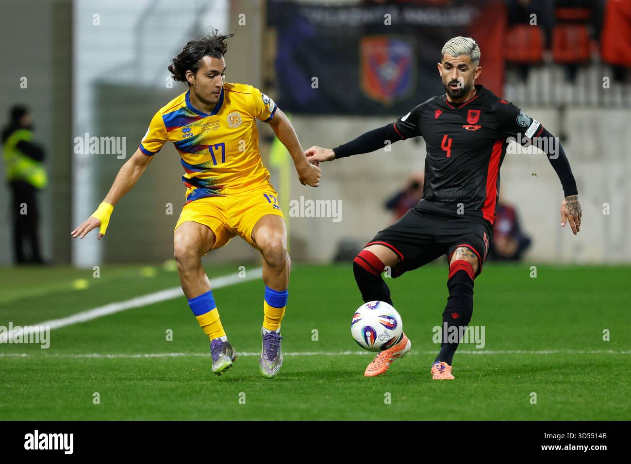 Andorra's Joan Cervos, left, vies for the ball with Albania's Elseid Hysaj during a World Cup 2026 group K qualifying soccer match between Andorra and Albania in Encamp, Andorra, Thursday, Nov. 13, 2025. (AP Photo/Joan Monfort) Stockfoto